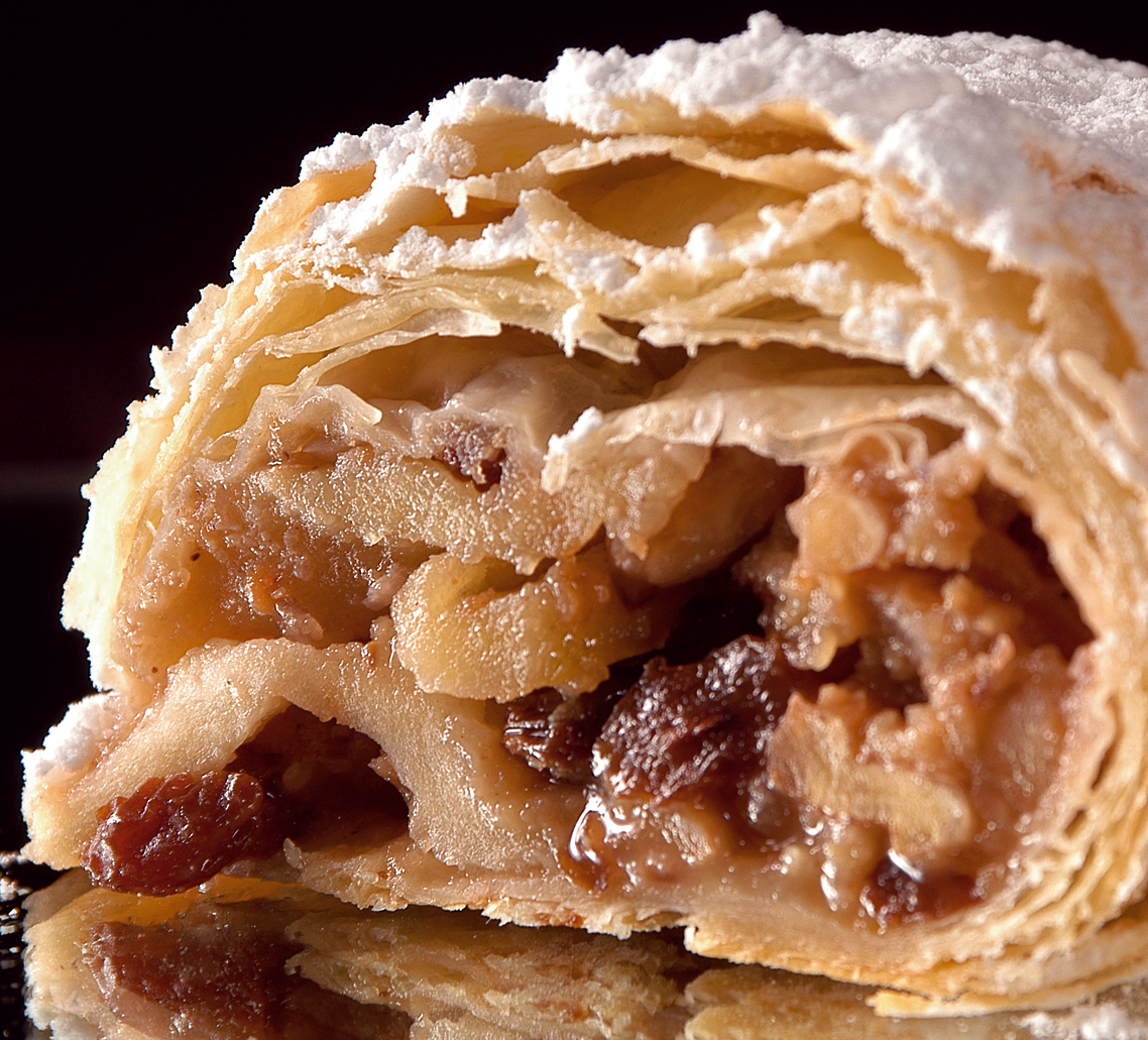 A slice of Viennese apple strudel on a plate