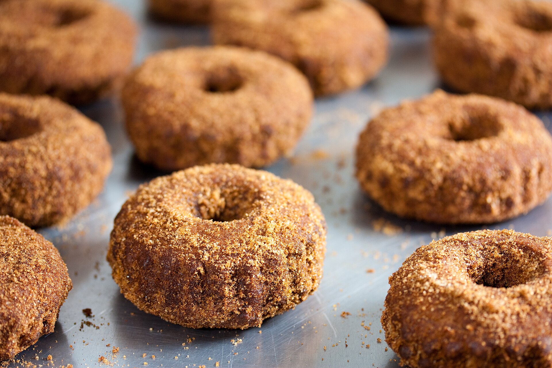 Apple cider doughnuts coated in cinnamon sugar