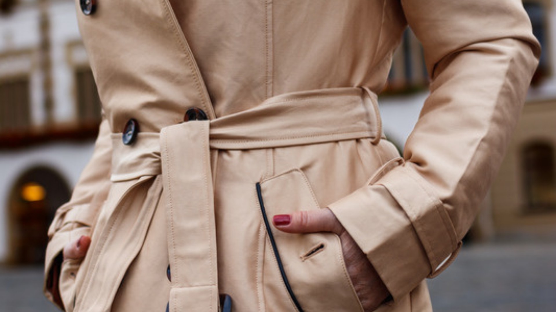 Beige trench coat on a city street