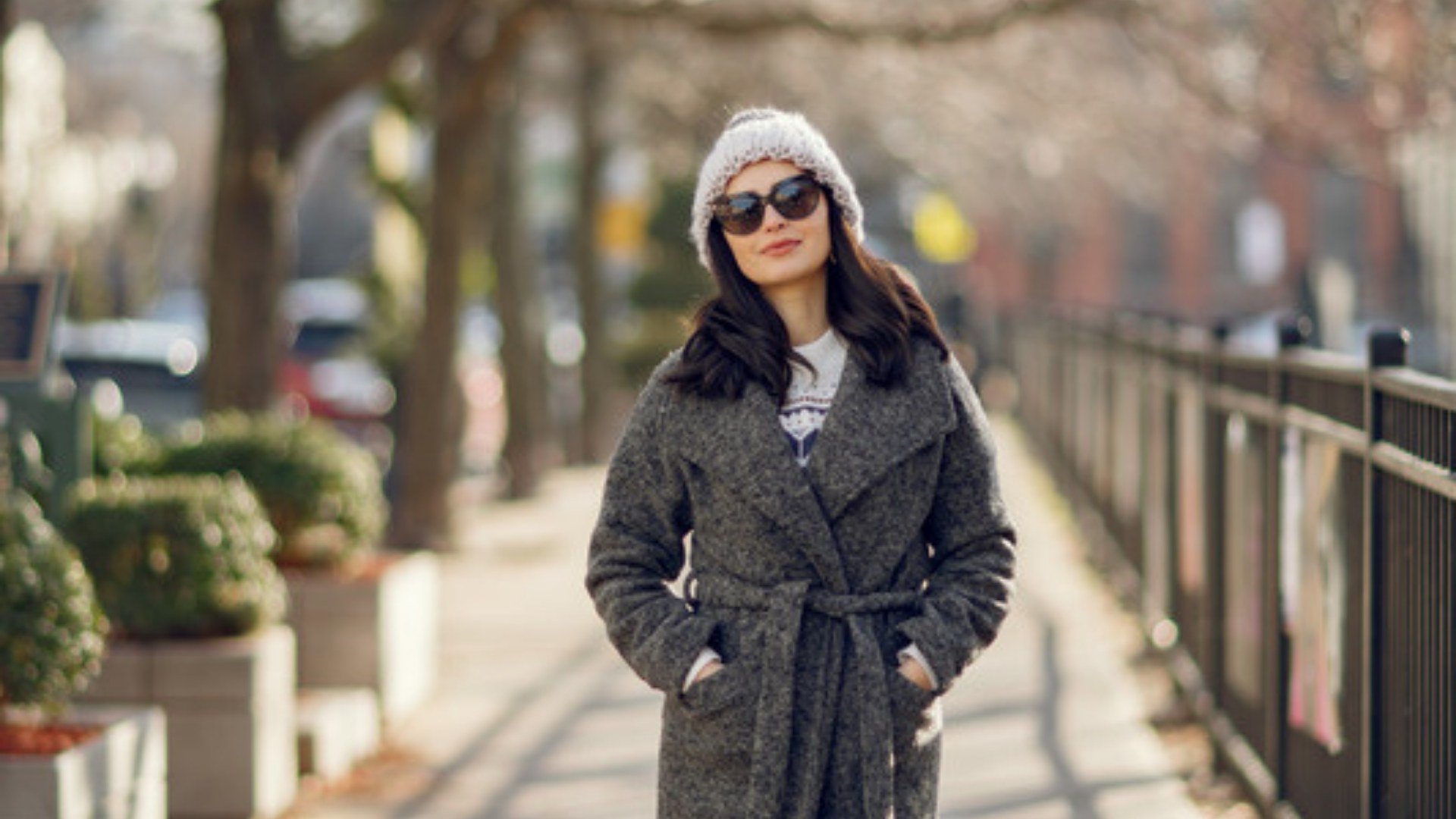 Woman in a gray wool coat on a city street