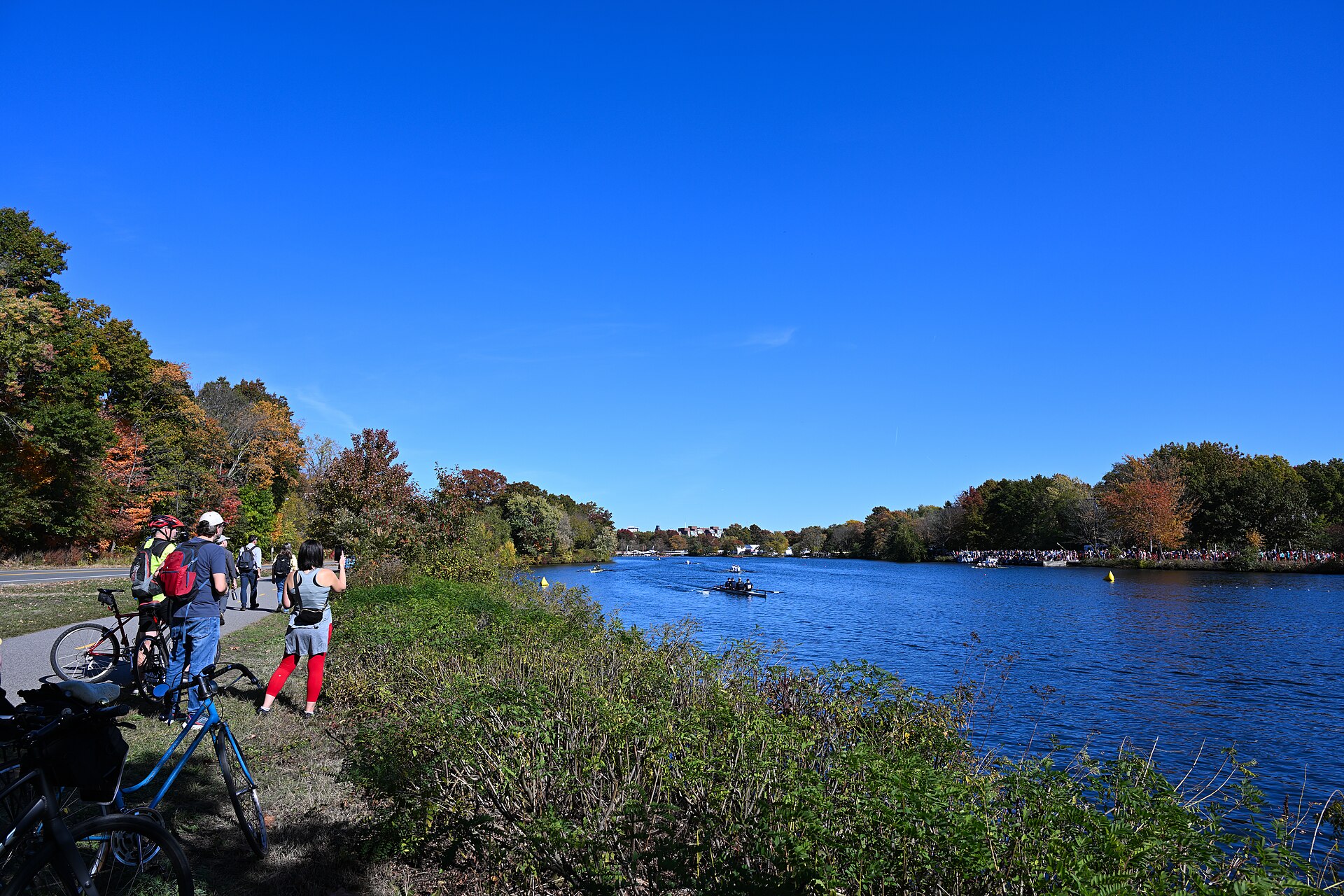 Rowers on the Charles River during regatta weekend, when Head of the Charles hotels fill up fast