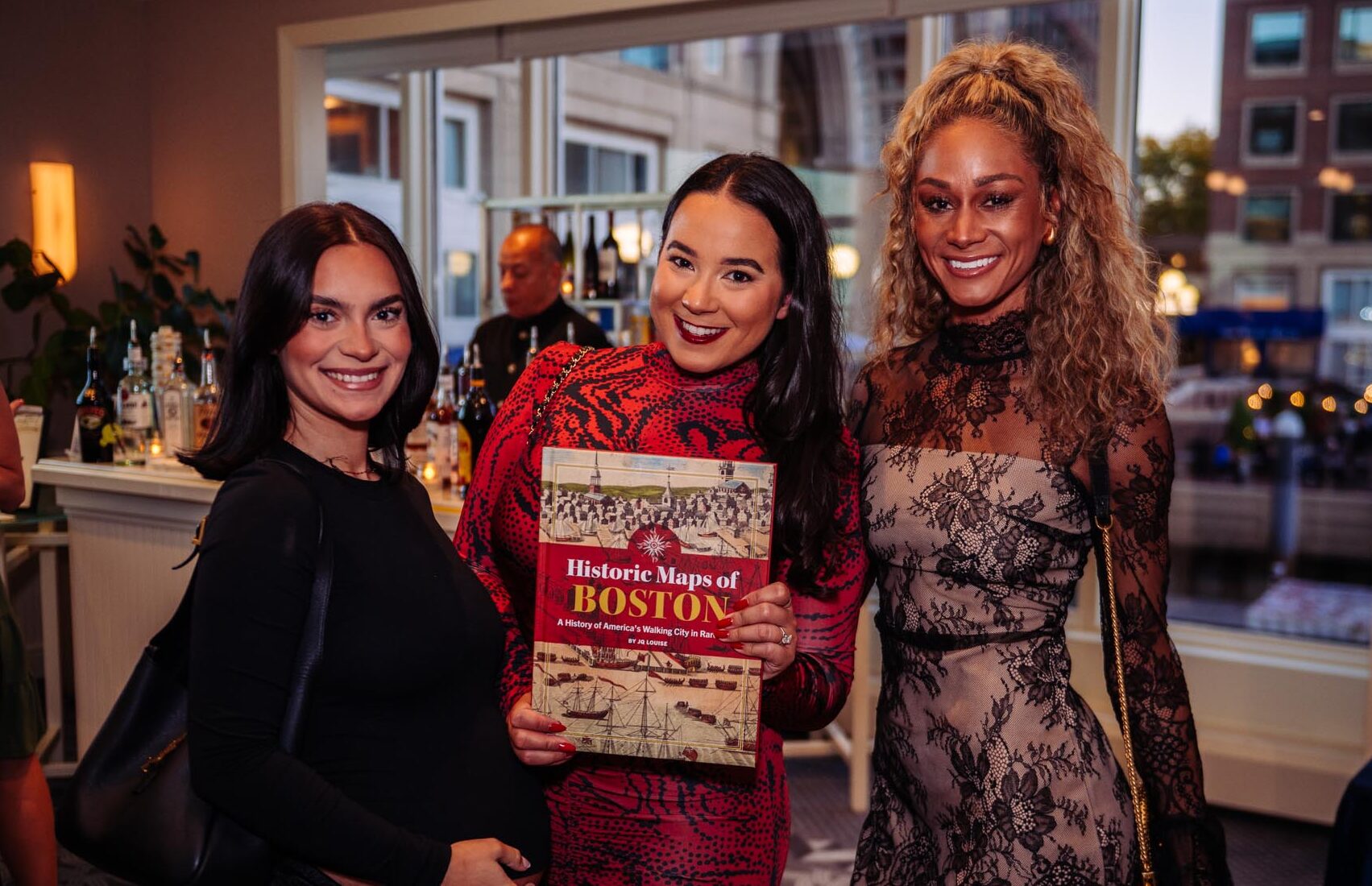 JQ Louise with two guests and her book at the Historic Maps of Boston book launch, Boston Harbor Hotel