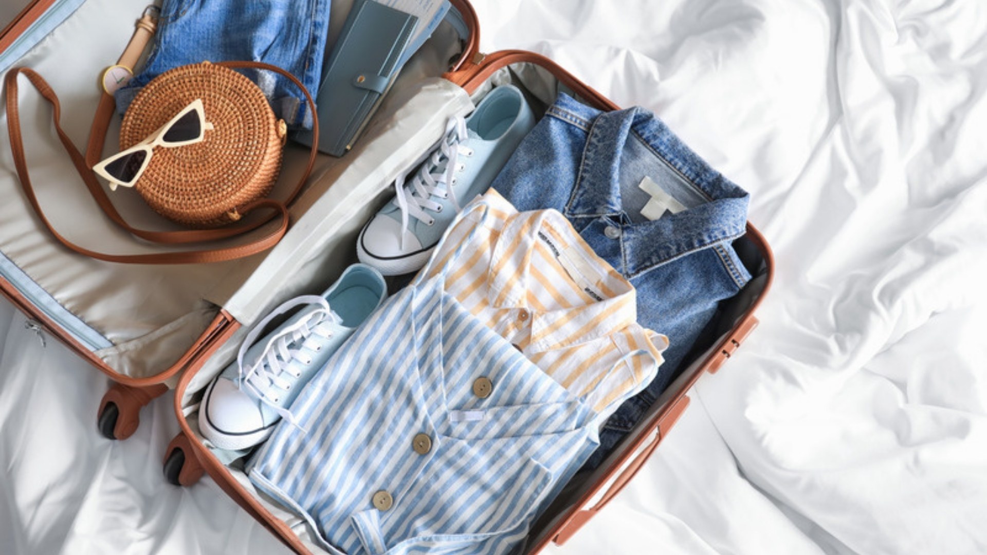 Packed suitcase on a bed
