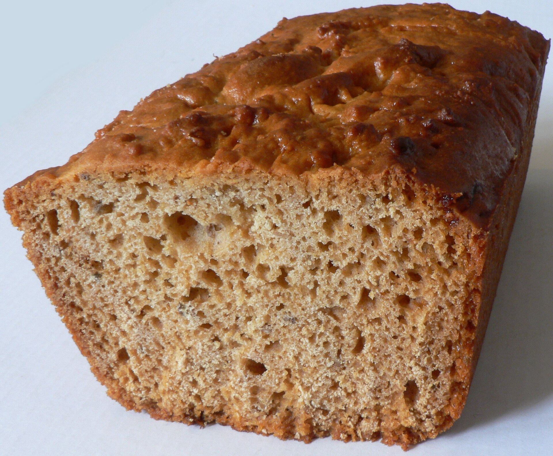 A loaf of pain d'épices on a cutting board