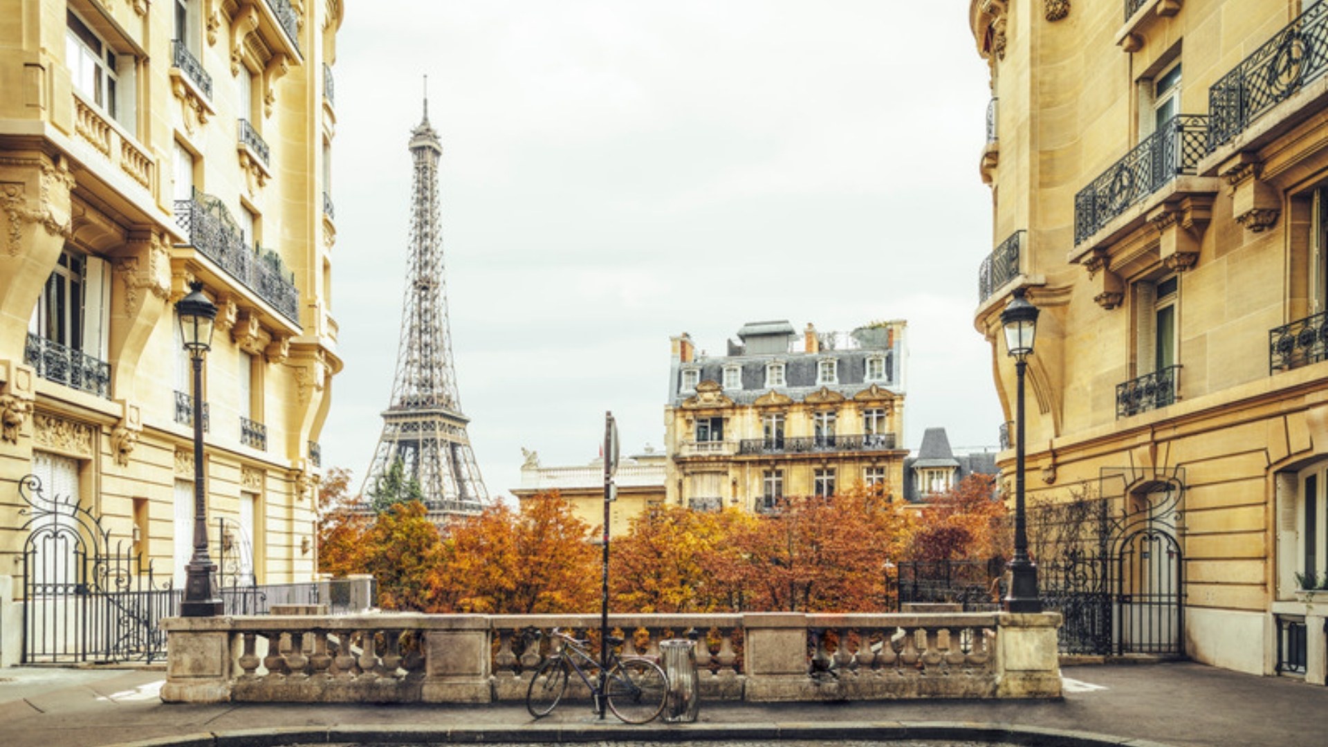 Paris street in autumn with the Eiffel Tower