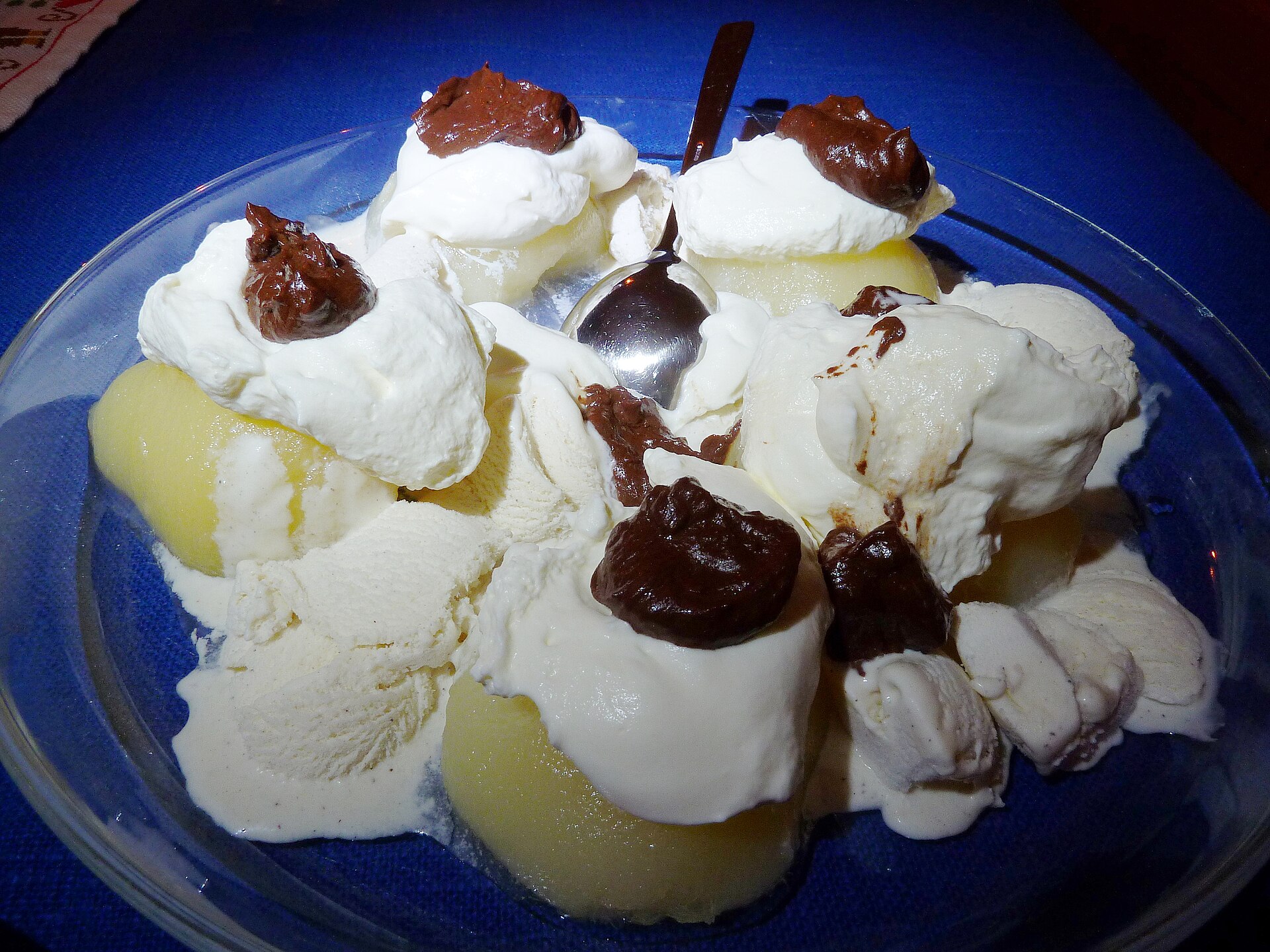 Poached pears with ice cream and chocolate sauce