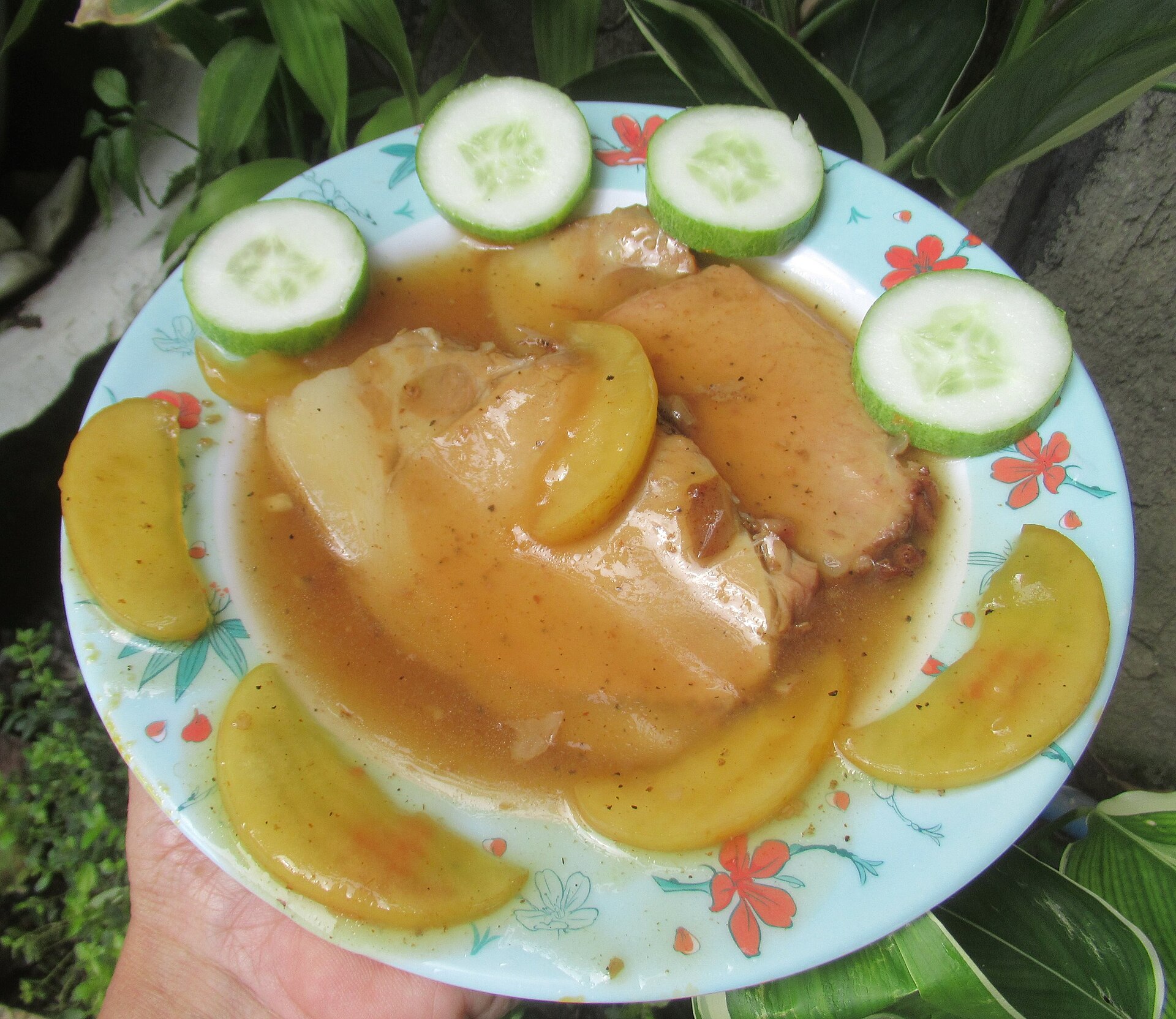 Pork chops with an apple sauce on a plate