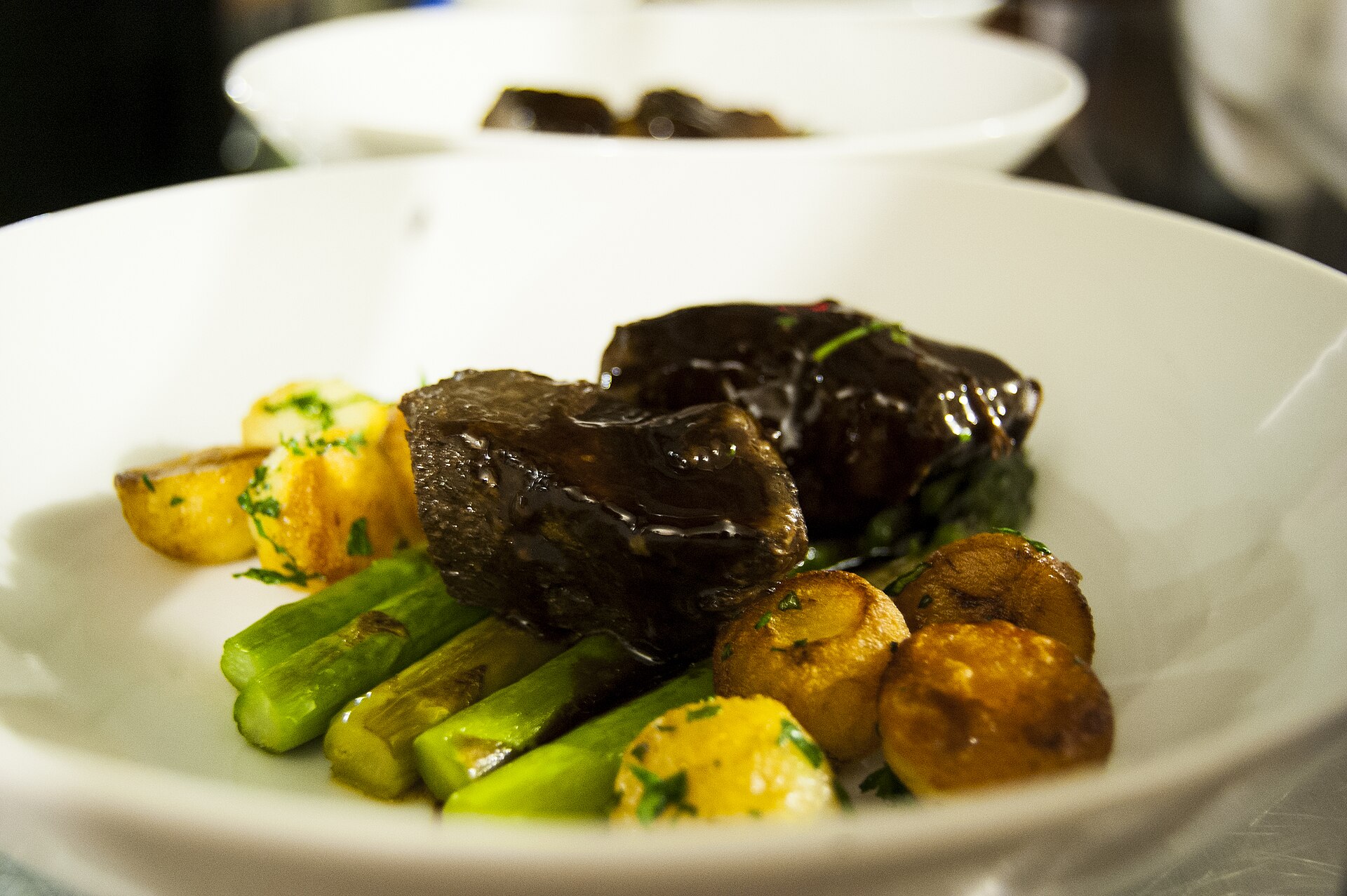 Red wine braised short ribs served in a bowl