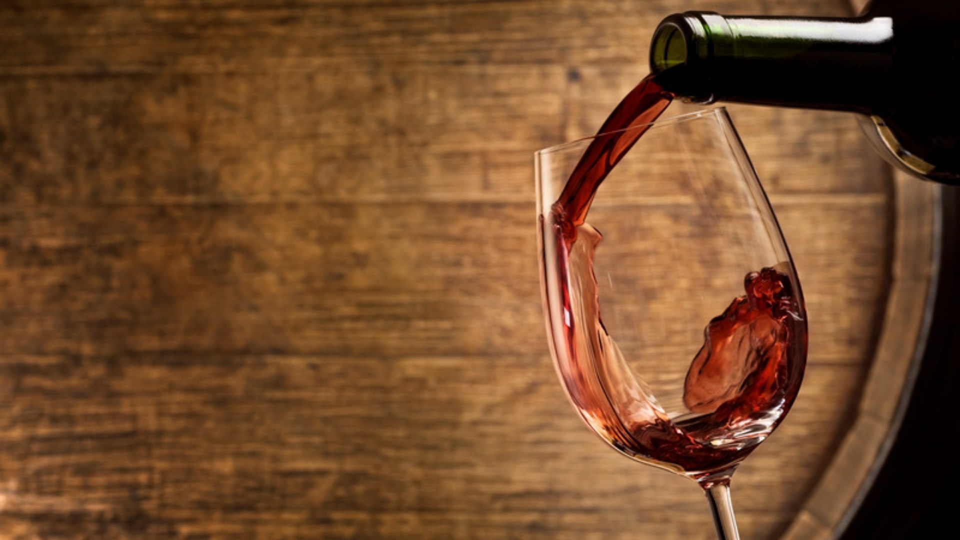 Red wine poured in a cellar